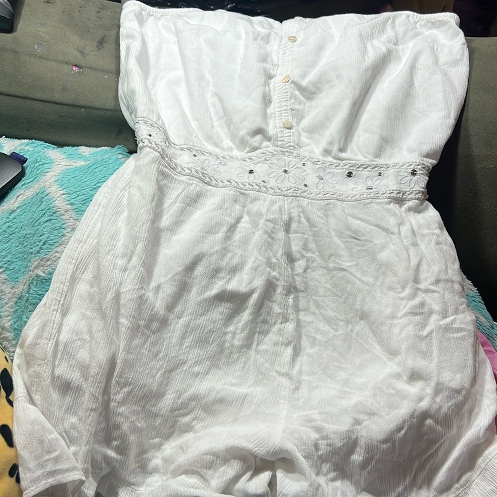 White one piece sleeveless jumper. Girls youth size 18. Floral and sequin waist